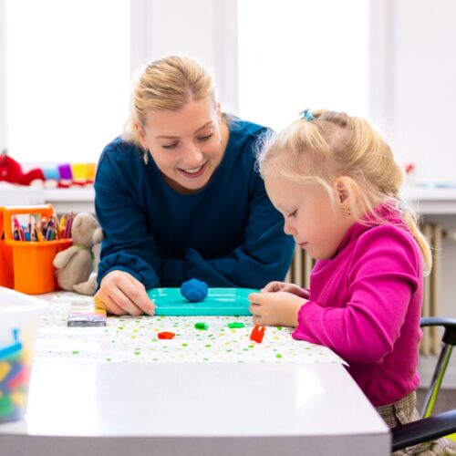 mom doing activity with preschooler daughter