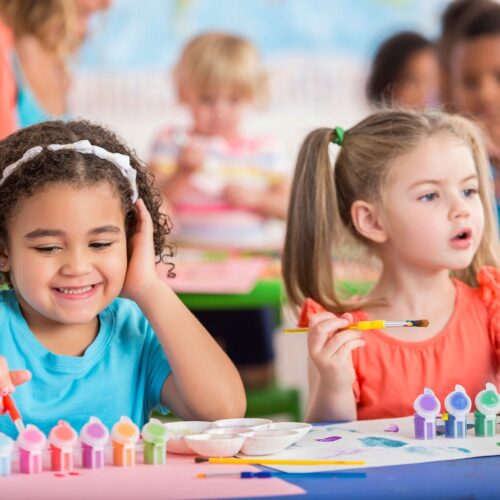 kids in preschool painting